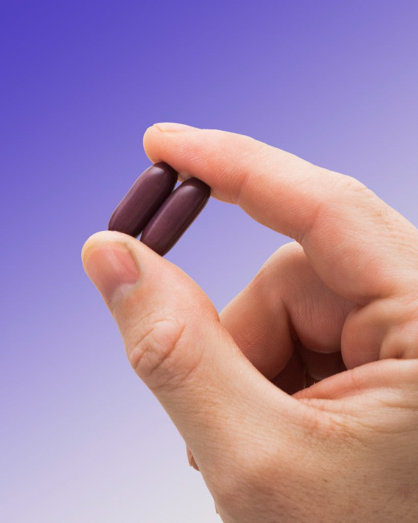 Hand holding TooHi soft gels